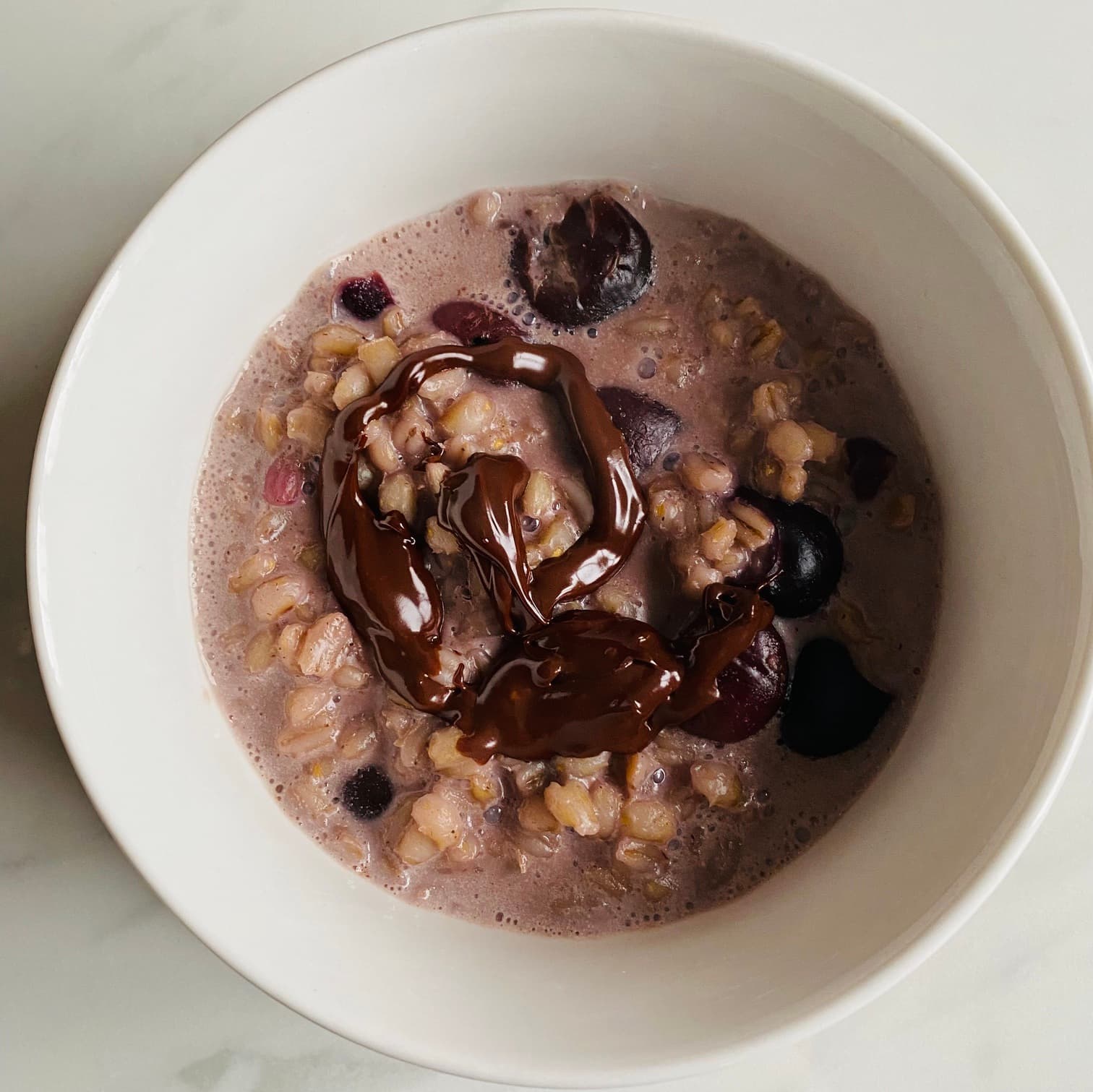 Cherry and chocolate pearl barley porridge