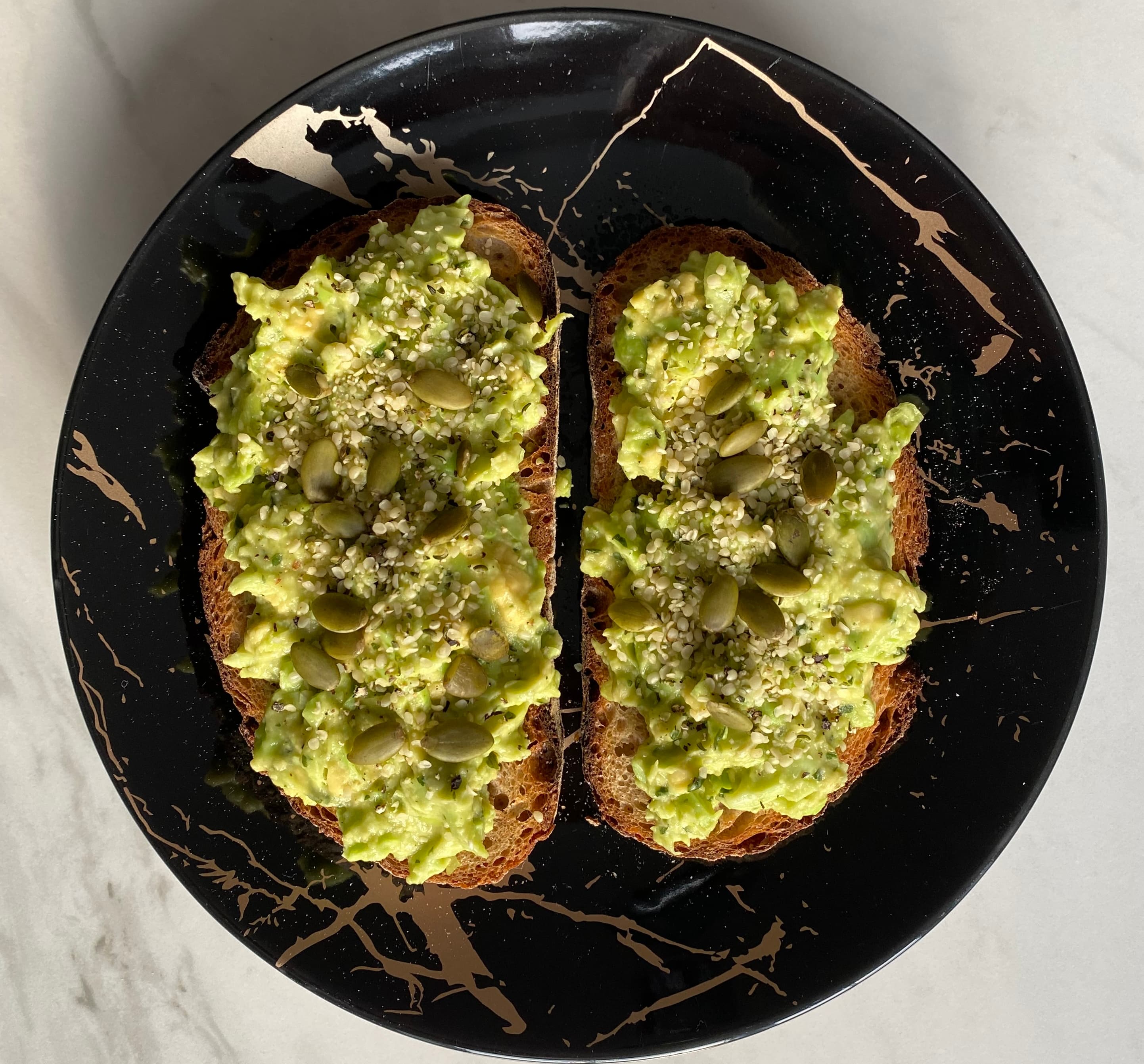 Mashed avocado and edamame on toast