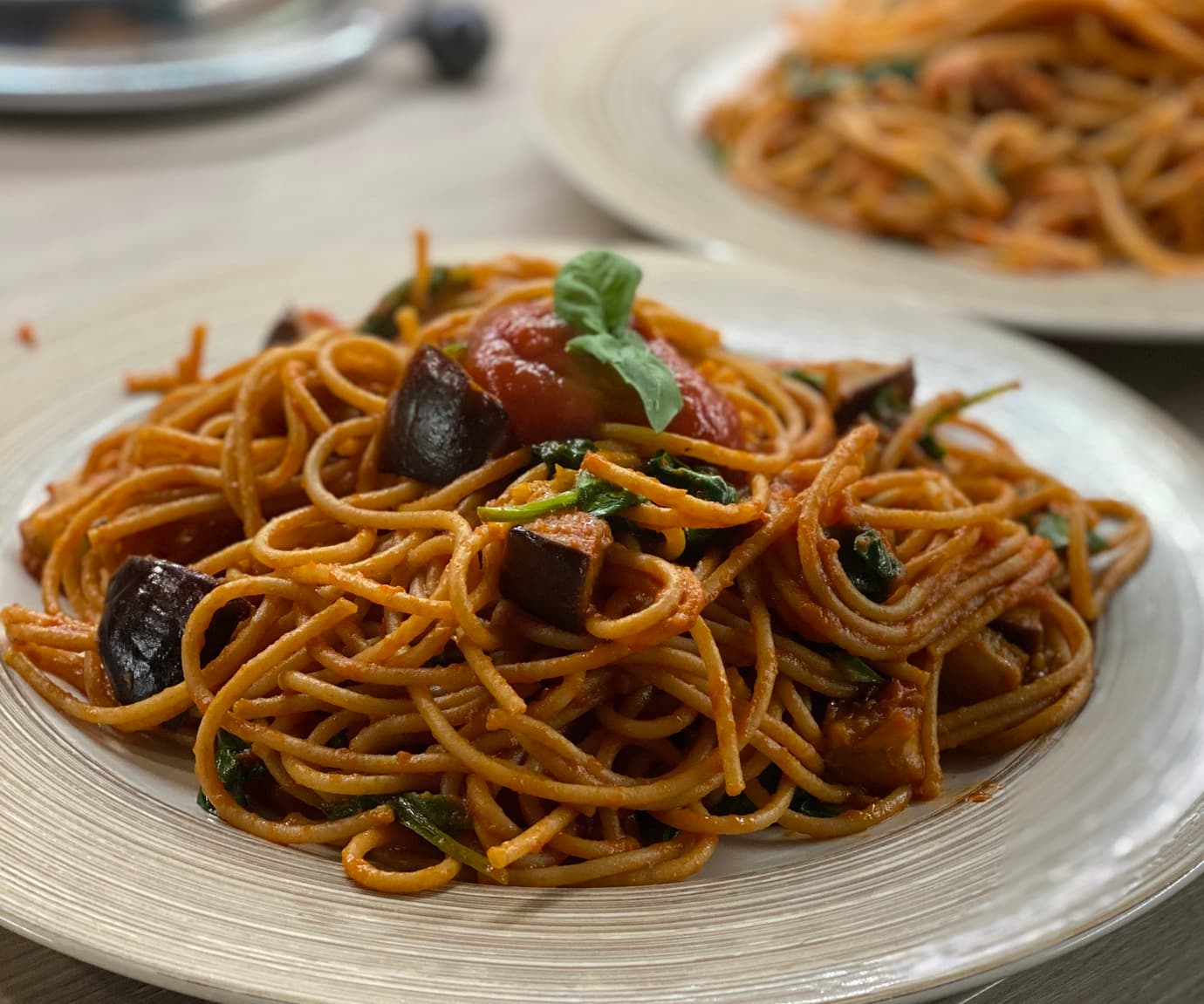 Pasta with tomato, spinach and aubergine