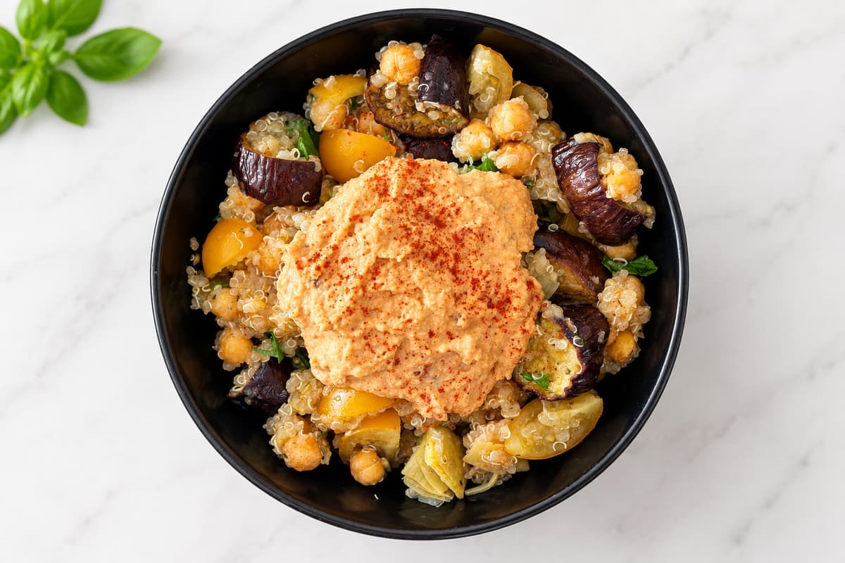 Quinoa, aubergine and hummus salad bowl