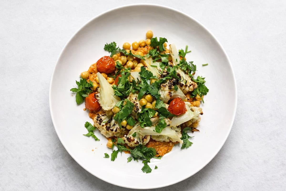 Roasted cauliflower and chickpea bowl with romesco sauce