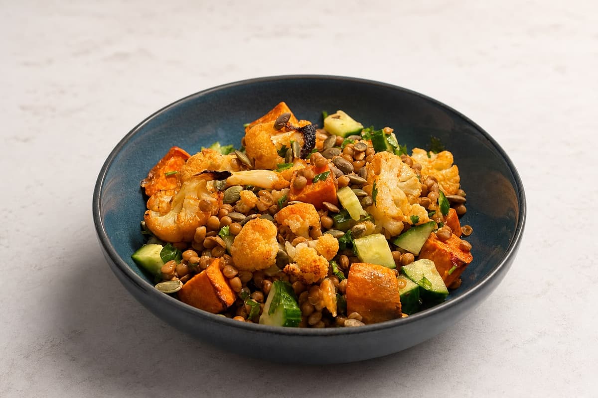 Roasted cauliflower and sweet potato bowl with lime and chilli dressing